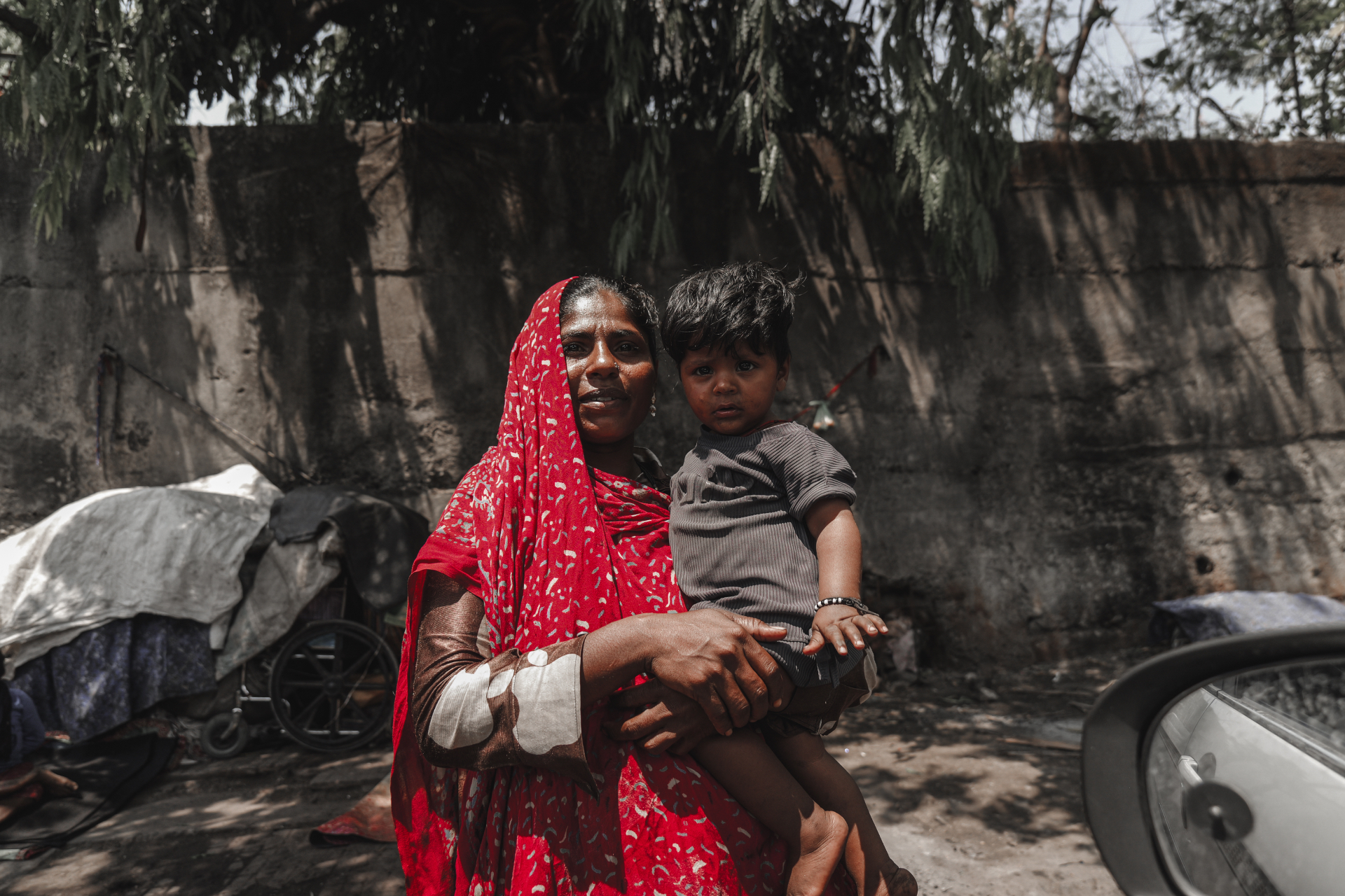 A mother, in red
